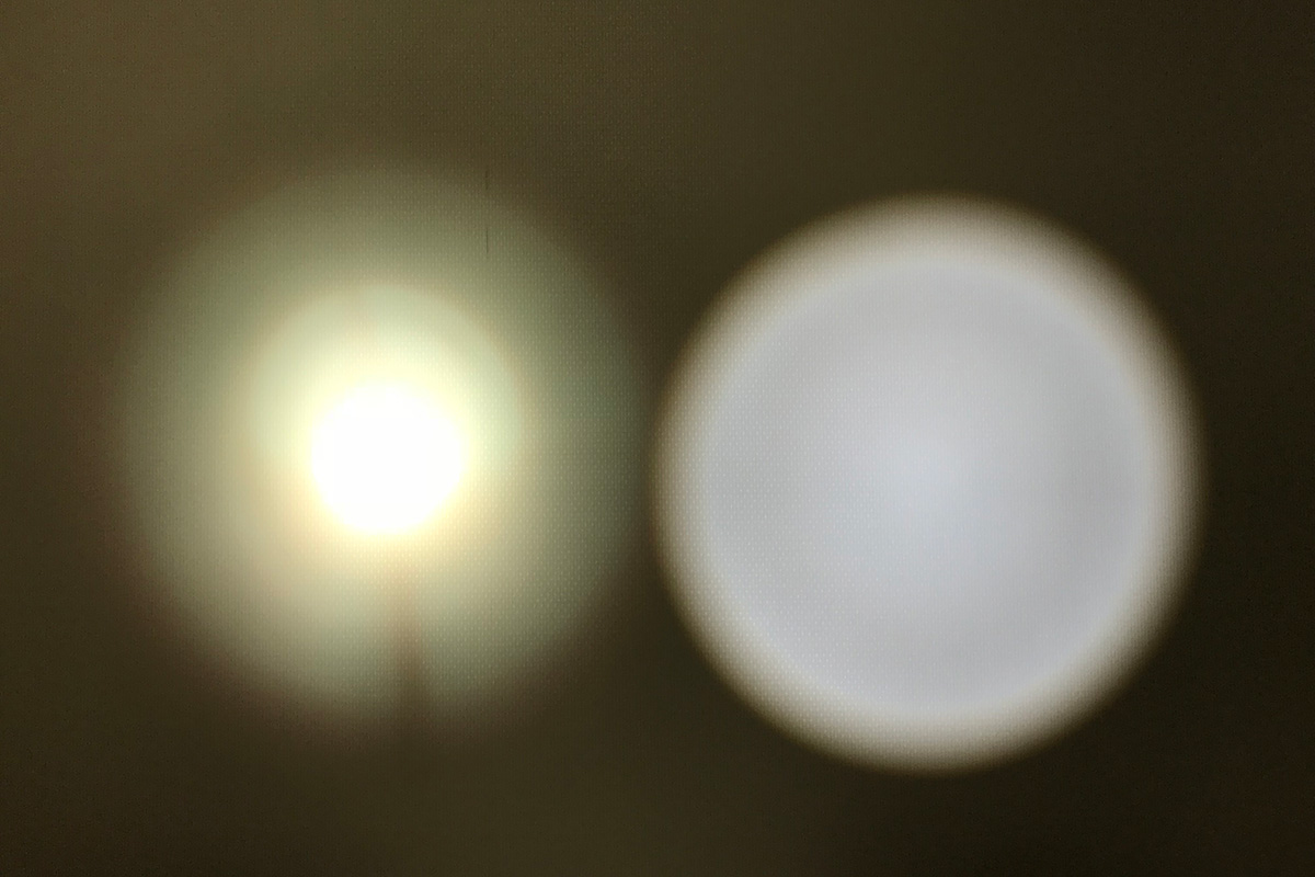 Comparison of illumination on a white wall in a dark room. Our searchlight ”ALPHA-1” (right) provides uniform illumination with no unevenness, while the competitor’s product (left) shows uneven brightness distribution.
